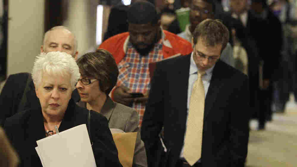 People wait in line to get into a job fair in Independence, Ohio, in November. People wait in line to get into a job fair in Independence, Ohio, in November.