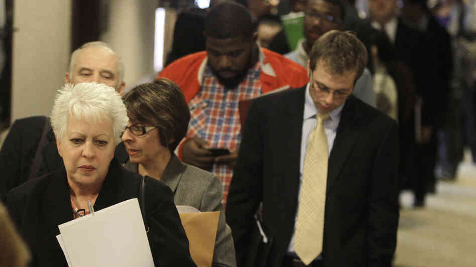 People wait in line to get into a job fair in Independence, Ohio, in November. People wait in line to get into a job fair in Independence, Ohio, in November.