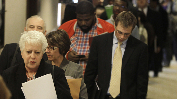 People wait in line to get into a job fair in Independence, Ohio, in November. (AP)