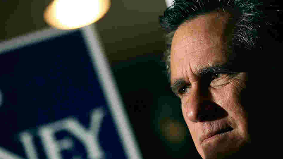 Mitt Romney waits to speak while being introduced Monday during a campaign stop in Mobile, Ala.