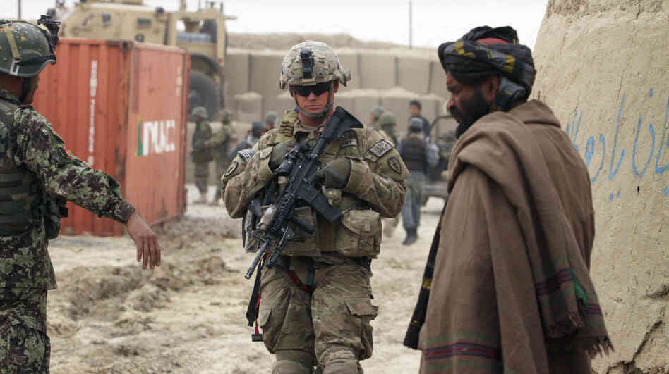 A U.S. soldier, part of the NATO-led International Security Assistance Force, stands outside a military base in Panjwai, Kandahar province, south of Kabul, on Sunday. A U.S. soldier, part of the NATO-led International Security Assistance Force, stands outside a military base in Panjwai, Kandahar province, south of Kabul, on Sunday.