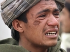 An Afghan youth mourns for relatives who were killed on Sunday. An Afghan youth mourns for relatives who were killed on Sunday.