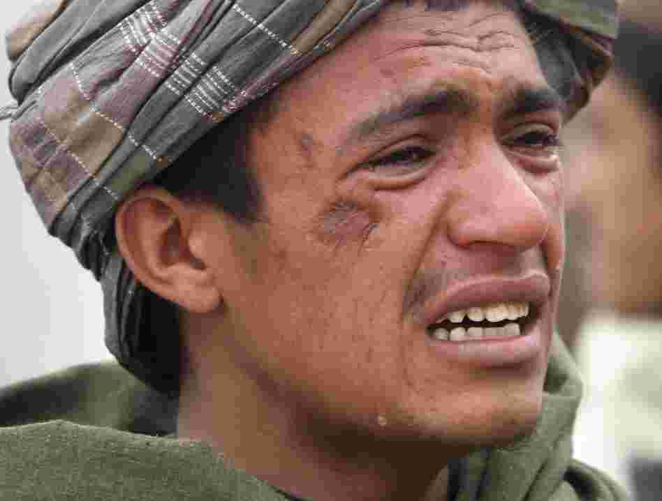 An Afghan youth mourns for relatives who were killed on Sunday.