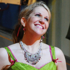 Joyce DiDonato performs in her wheelchair and pink cast after breaking her leg in a production of  Rossini's Barber of Seville, at London's Royal Opera House.
