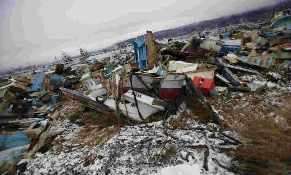 Demolished ships lie strewn about near the fishing port of Minamisanriku town, in Miyagi prefecture, northeastern Japan, Feb. 23, 2012. The local fisherman's union says last year's tsunami wiped out 90 percent of local fishing boats.