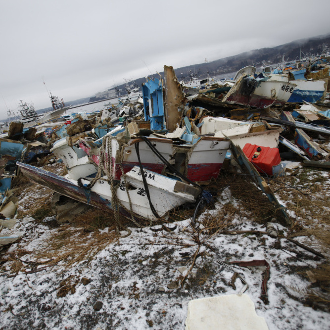 Demolished ships lie strewn about near the fishing port of Minamisanriku town, in Miyagi prefecture, northeastern Japan, Feb. 23, 2012. The local fisherman's union says last year's tsunami wiped out 90 percent of local fishing boats.