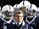 Penn State head coach Joe Paterno stands with his team before they take the field during an NCAA college football game against the University of Wisconsin in State College, Pa., on Oct. 13, 2007. Penn State head coach Joe Paterno stands with his team before they take the field during an NCAA college football game against the University of Wisconsin in State College, Pa., on Oct. 13, 2007.