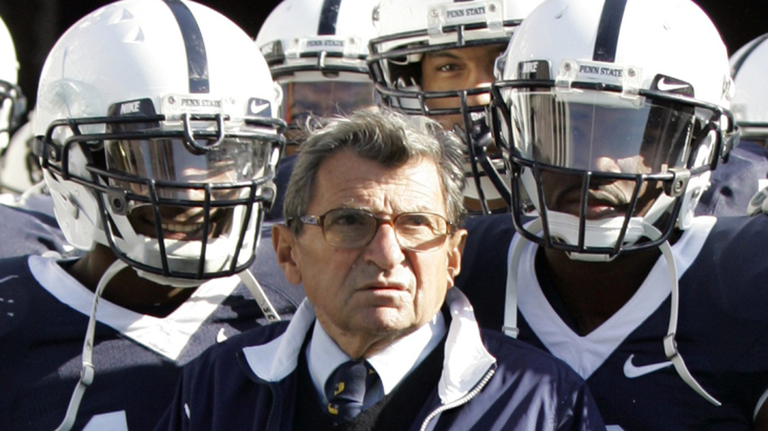 Penn State head coach Joe Paterno stands with his team before they take the field during an NCAA college football game against the University of Wisconsin in State College, Pa., on Oct. 13, 2007.