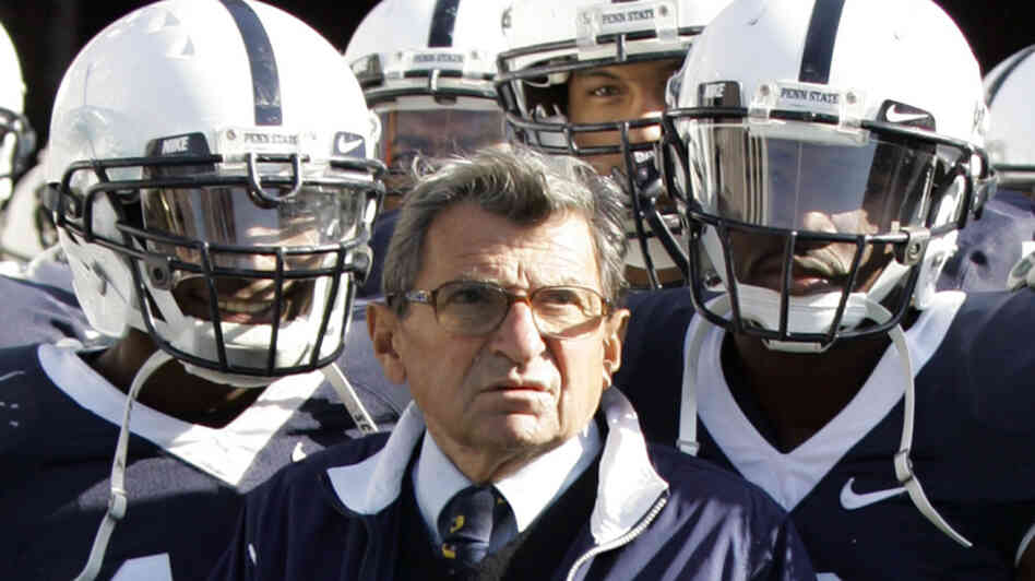 Penn State head coach Joe Paterno stands with his team before they take the field during an NCAA college football game against the University of Wisconsin in State College, Pa., on Oct. 13, 2007.