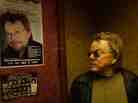 Paul Williams stares at a poster advertising an upcoming performance in the documentary Paul Williams Still Alive.