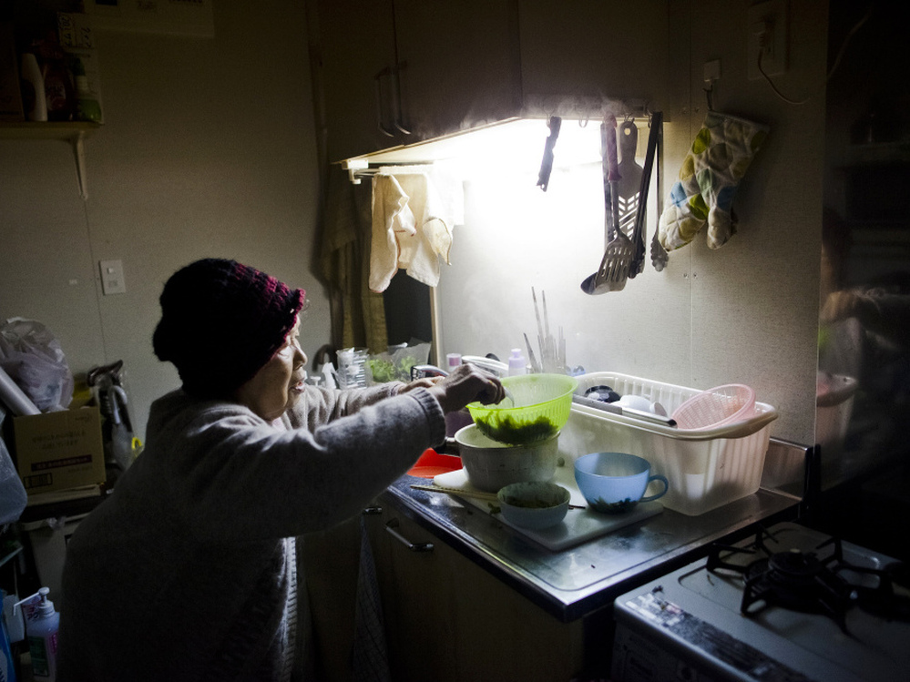 Last year's tsunami destroyed Tamiko Abe's house, and a year later, the 71-year-old (shown here March 5, 2012) still lives in temporary housing. 