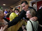 Republican presidential candidate Mitt Romney greets supporters at the Whistle Stop cafe in Mobile, Ala., on Monday, his birthday. Republican presidential candidate Mitt Romney greets supporters at the Whistle Stop cafe in Mobile, Ala., on Monday, his birthday.