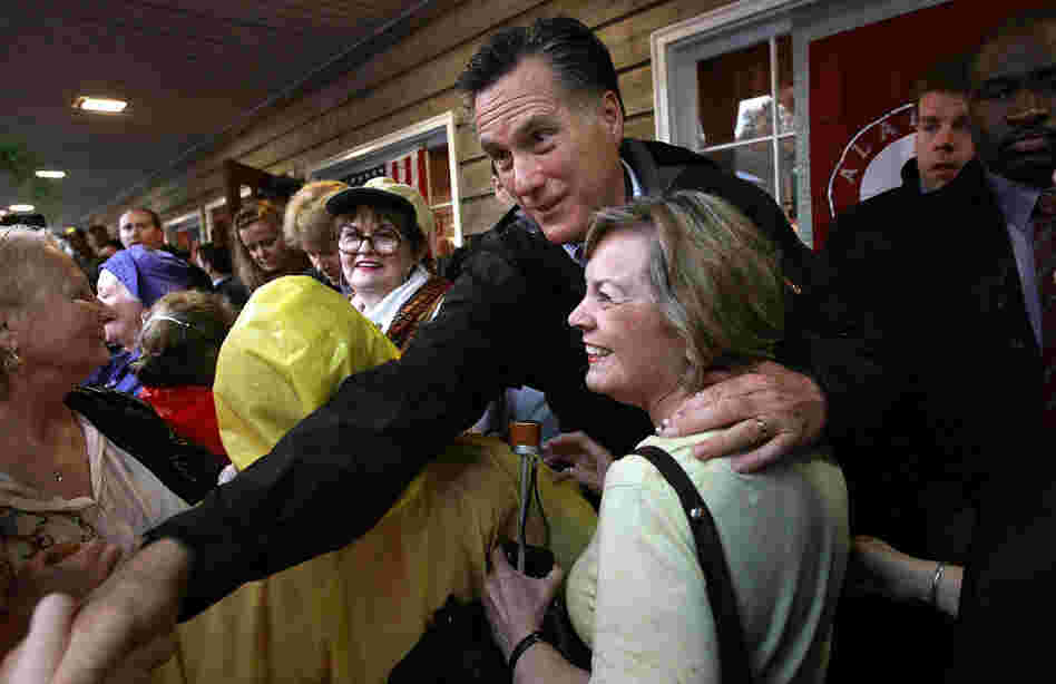 Republican presidential candidate Mitt Romney greets supporters at the Whistle Stop cafe in Mobile, Ala., on Monday, his birthday. 