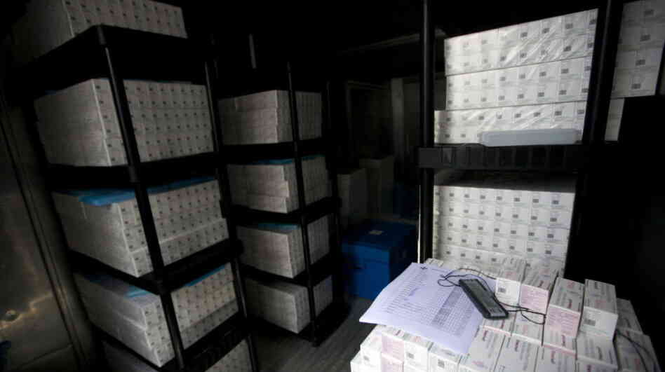 Thousands of doses of cholera vaccine sit in a refrigerated trailer in a United Nations compound in Saint-Marc, Haiti. Vaccination was supposed to begin last week, but bureaucratic problems have delayed the start. April is the beginning of Haiti's rainy season, which will likely intensify Haiti's cholera outbreak. Thousands of doses of cholera vaccine sit in a refrigerated trailer in a United Nations compound in Saint-Marc, Haiti. Vaccination was supposed to begin last week, but bureaucratic problems have delayed the start. April is the beginning of Haiti's rainy season, which will likely intensify Haiti's cholera outbreak.