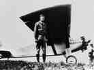 American aviator Charles Lindbergh poses in front of his monoplane Spirit of St-Louis at Paris-Le Bourget, May 21 1927, after having achieved the first solo non-stop transatlantic flight from New York to Paris.