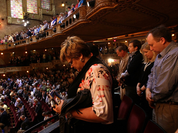Alabama voters bow their heads in prayer before the start of the Alabama Republican Presidential Forum on March 12 in Birmingham, Ala. 