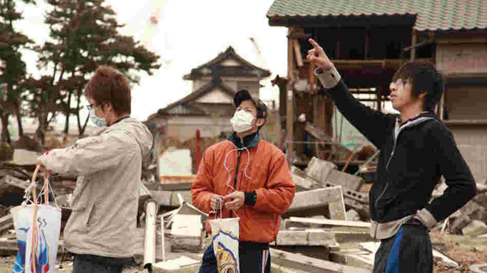 High-school student Kento Ito (right) and friends prepare for a Children's Day ceremony honoring Kento's little brother, Ritsu-kun, and others who perished in the Tohoku earthquake and tsunami of March 2011. High-school student Kento Ito (right) and friends prepare for a Children's Day ceremony honoring Kento's little brother, Ritsu-kun, and others who perished in the Tohoku earthquake and tsunami of March 2011.