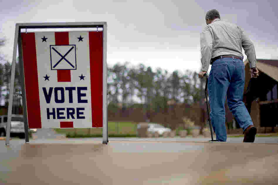 A voter leaves a polling place in Birmingham, Ala. Alabama, Mississippi and Hawaii also held presidential-nominating contests on Tuesday. 
