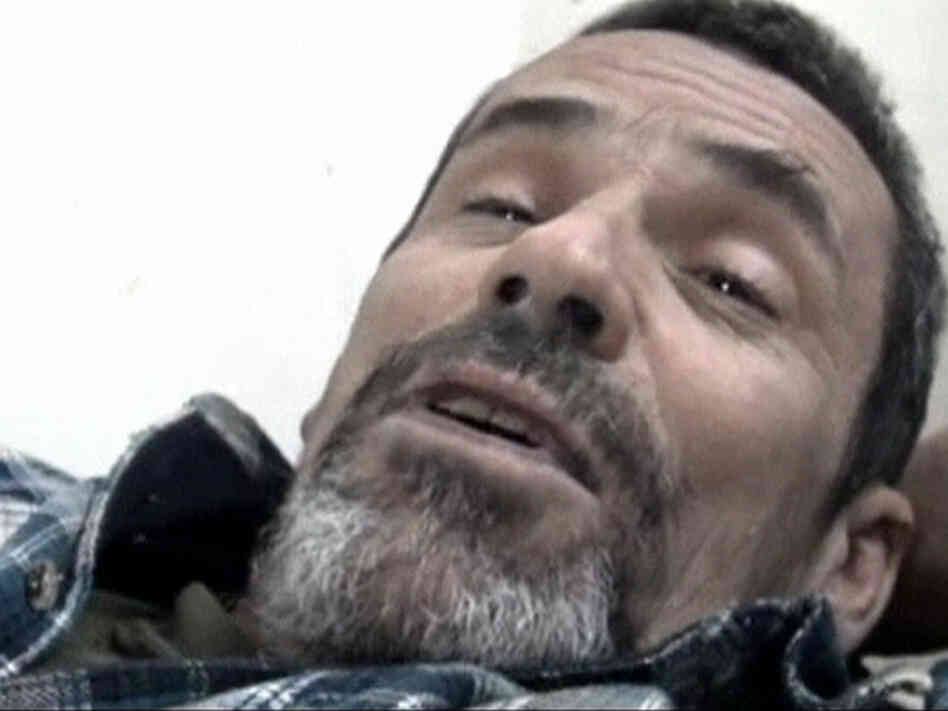 British photographer Paul Conroy lies on a stretcher as he is treated by a doctor in Homs on Feb. 22. Avaaz coordinated Conroy's rescue from the embattled city, an operation that left 13 Syrian activists dead.