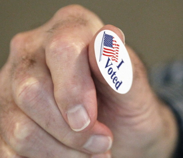 In Madison, Miss., earlier today, precinct worker Bob Shirley was handing out "I Voted" stickers. 