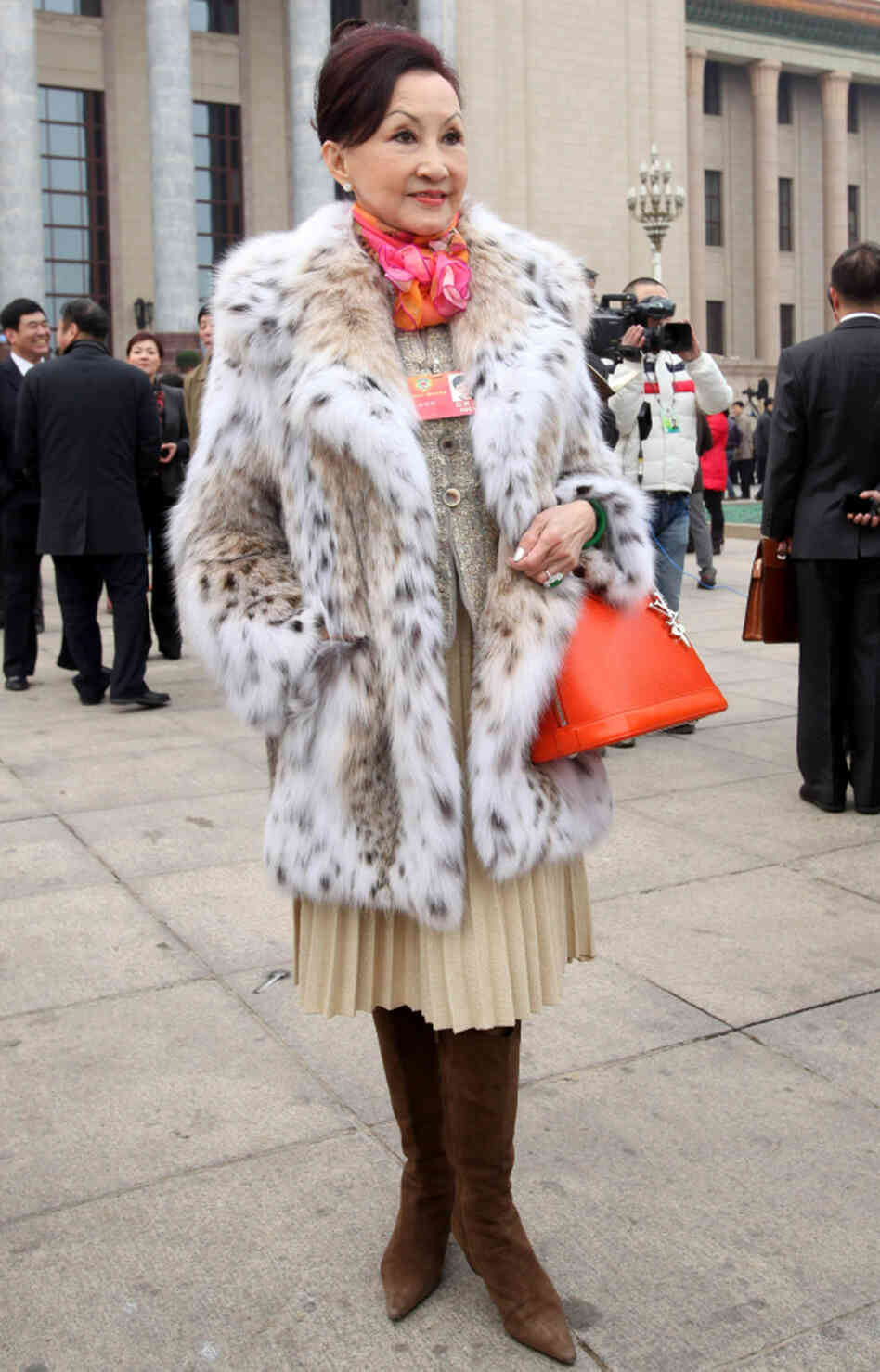 Delegate and Hong Kong cosmetics entrepreneur Cheng Ming Ming carries a Louis Vuitton Alma handbag and wears a fur coat in Beijing, on March 3. Her bag is said to be worth $2,500. Delegate and Hong Kong cosmetics entrepreneur Cheng Ming Ming carries a Louis Vuitton Alma handbag and wears a fur coat in Beijing, on March 3. Her bag is said to be worth $2,500.