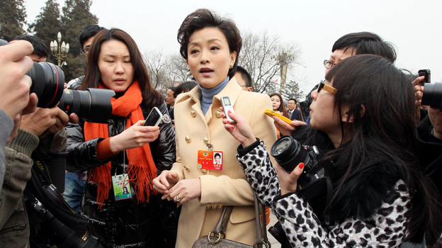 Yang Lan, TV host and delegate to the Chinese People's Political Consultative Conference, carries a Marc Jacobs handbag outside the Great Hall of the People in Beijing on March 3. Nicknamed "the Oprah Winfrey of China," Yang has also been seen wearing a Giorgio Armani jacket during the legislative session. 