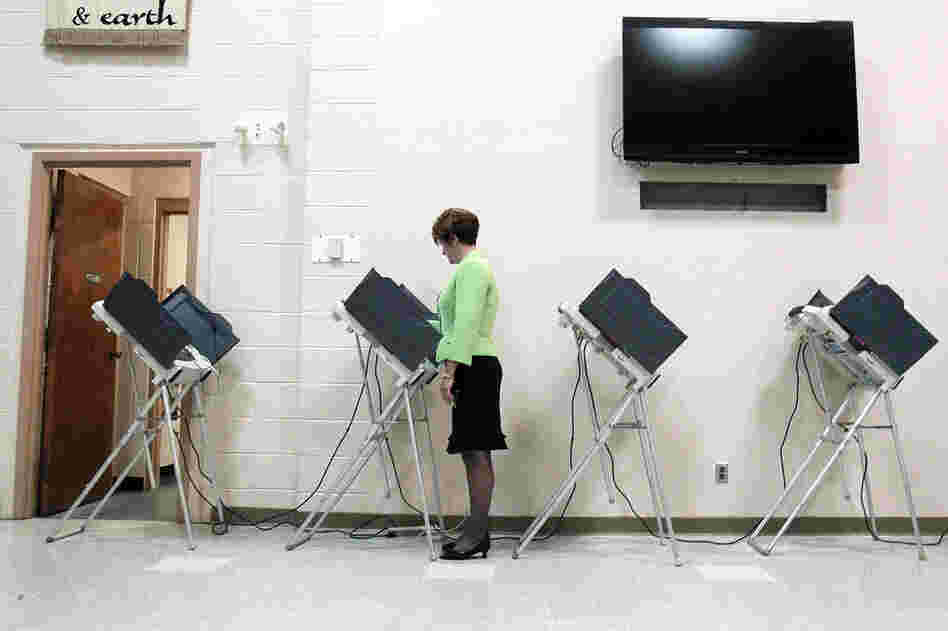 A woman votes in Madison, Miss. The state plays an unaccustomed high-profile role in the GOP presidential nomination. 