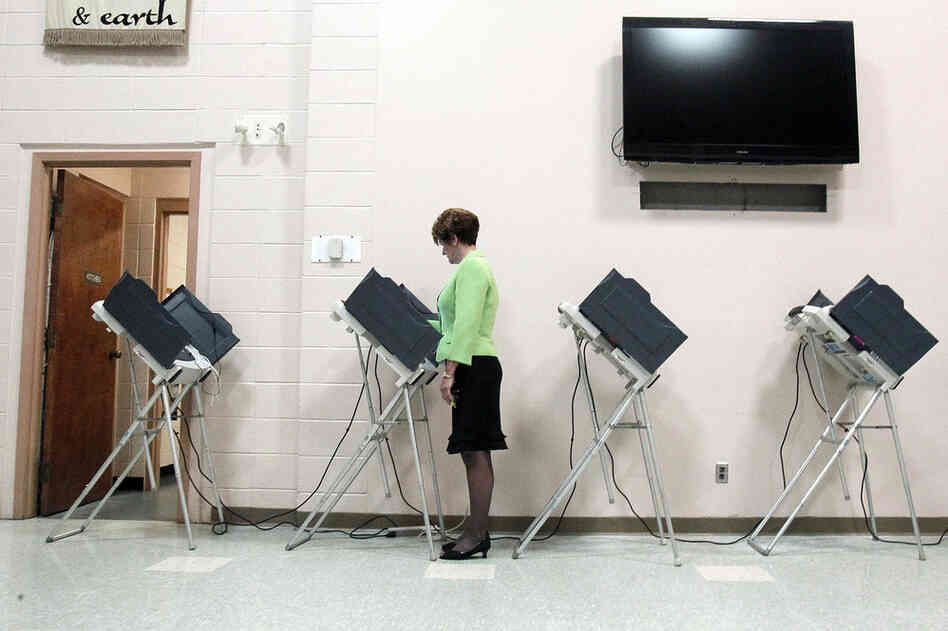 A woman votes in Madison, Miss. The state plays an unaccustomed high-profile role in the GOP presidential nomination. 