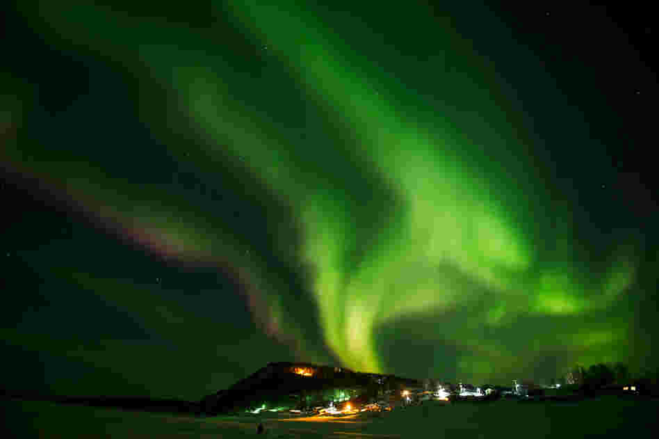 The aurora borealis swirls in the sky over the Yukon River village of Ruby, Alaska, a checkpoint of the race, on Friday. 