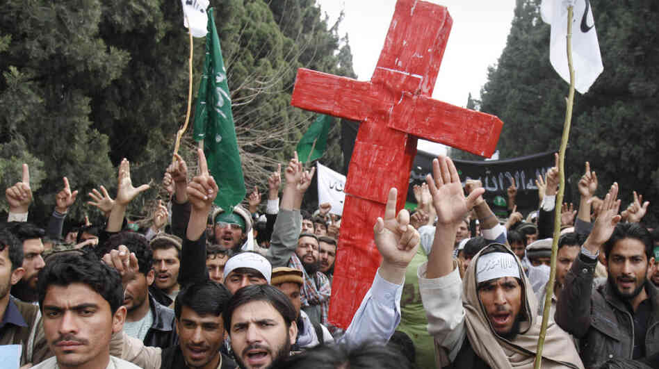 The Afghan response to Sunday's shooting deaths of 16 Afghan civilians has been limited compared with the recent outrage over the burning of Qurans. In one of the few protests, demonstrators chanted anti-U.S. slogans in the eastern city of Jalalabad on Tuesday. The Afghan response to Sunday's shooting deaths of 16 Afghan civilians has been limited compared with the recent outrage over the burning of Qurans. In one of the few protests, demonstrators chanted anti-U.S. slogans in the eastern city of Jalalabad on Tuesday.