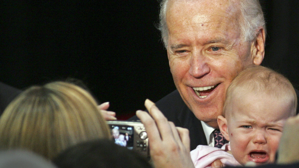 Vice President Joe Biden poses with an uncooperative baby at a speech in Tallahassee, Fla., on Feb. 6. On Thursday, he's in Ohio to begin a series of speeches aimed at framing the presidential race.