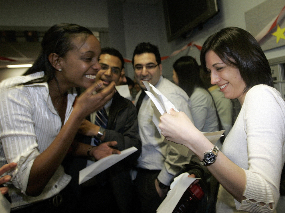 Boston University medical students Miriam Shiferaw (left) and Nawal Momani check letters together to find out where they have been accepted for their residencies during Match Day in 2007. 