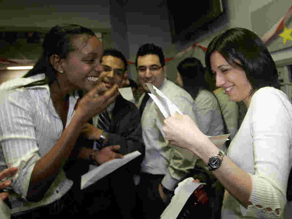 Boston University medical students Miriam Shiferaw (left) and Nawal Momani check letters together to find out where they have been accepted for their residencies during Match Day in 2007. 