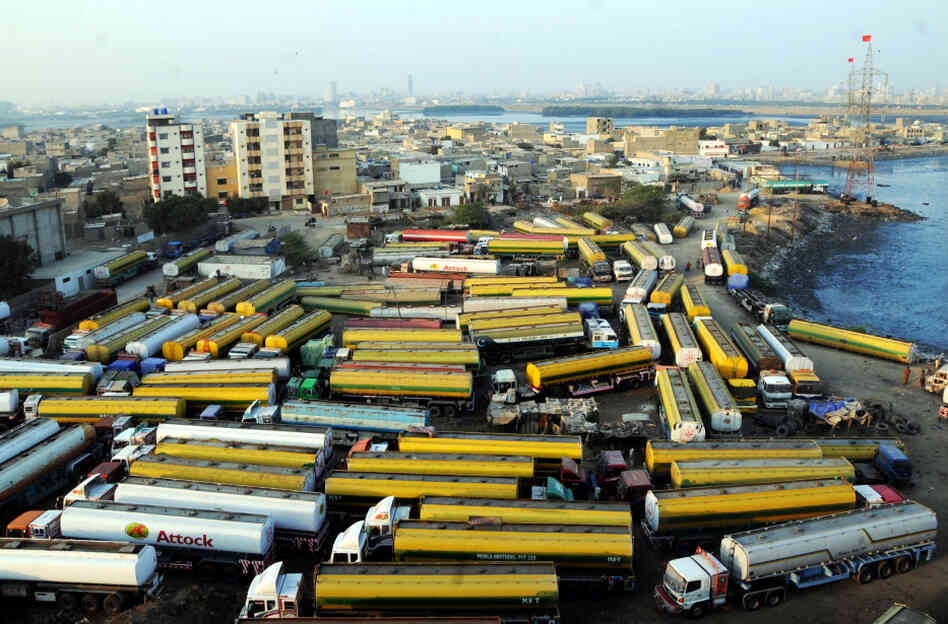 Oil tankers sit at a NATO supply terminal in the southern Pakistani port city of Karachi on Feb. 9. In November, Pakistan's government shut down the main routes for bringing supplies to U.S. and NATO troops in Afghanistan. Oil tankers sit at a NATO supply terminal in the southern Pakistani port city of Karachi on Feb. 9. In November, Pakistan's government shut down the main routes for bringing supplies to U.S. and NATO troops in Afghanistan.