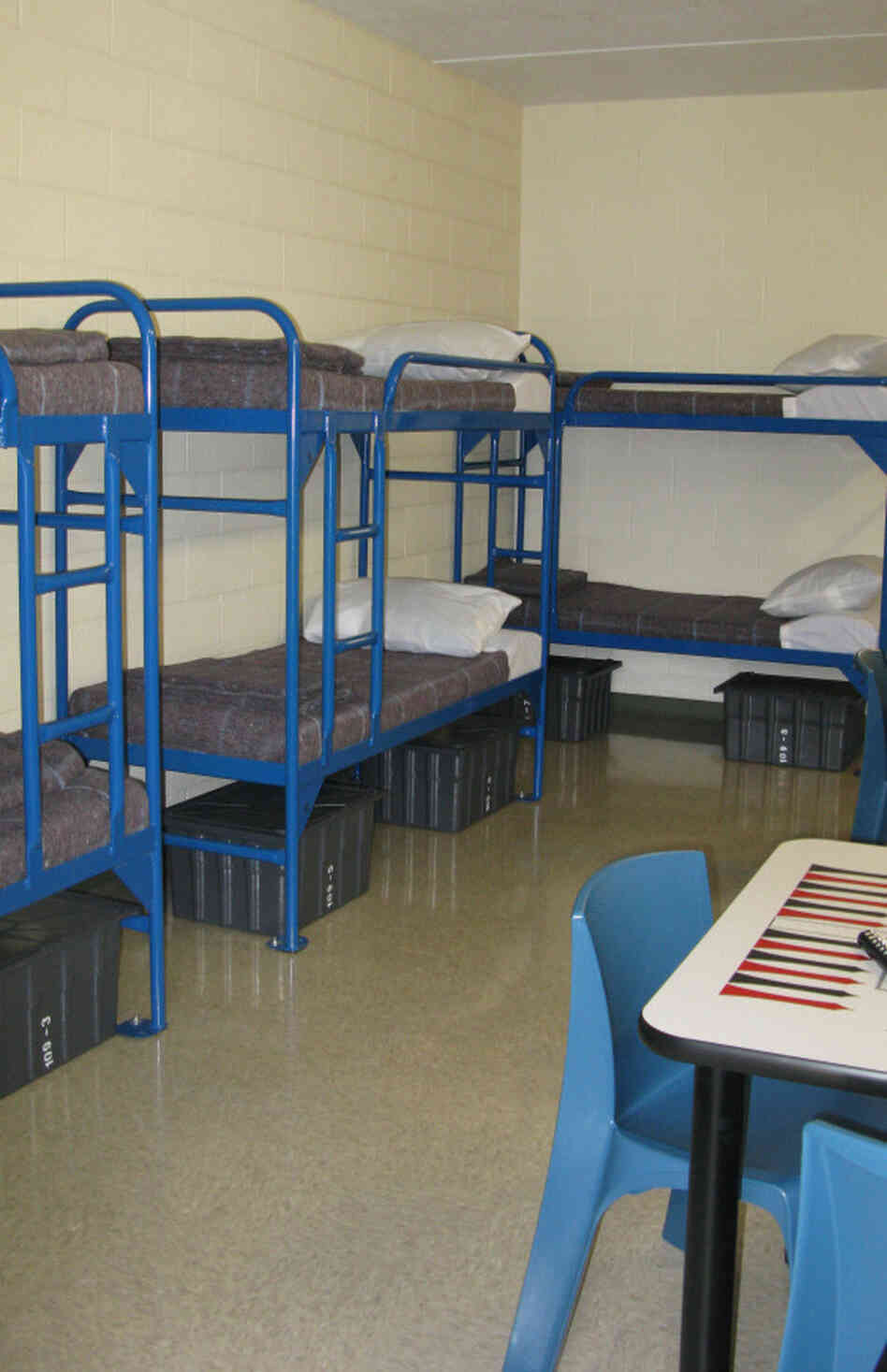 Detainees will sleep eight to a room, with a private bath, and will be permitted to move around the detention center largely unescorted. Detainees will sleep eight to a room, with a private bath, and will be permitted to move around the detention center largely unescorted.