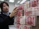 There is an advantage to strengthening the currency for people in China: It makes their imports cheaper. A clerk counts bank notes in a bank in Nantong, east China's Jiangsu Province. There is an advantage to strengthening the currency for people in China: It makes their imports cheaper. A clerk counts bank notes in a bank in Nantong, east China's Jiangsu Province.