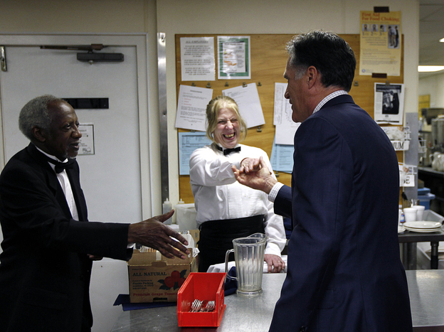Mitt Romney shakes hands with hotel staffers in the Cleveland suburbs in February. 