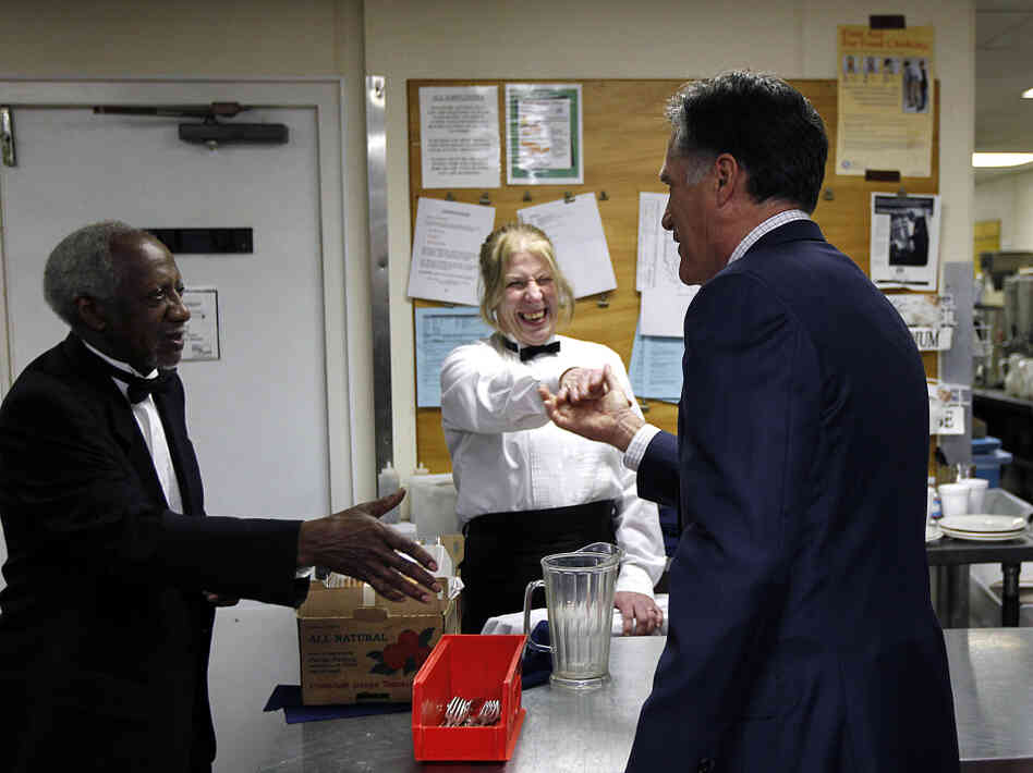 Mitt Romney shakes hands with hotel staffers in the Cleveland suburbs in February. 