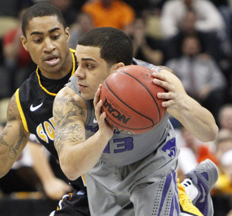Kansas State's Angel Rodriguez (13) gets control of a loose ball in front of Southern Mississippi's Neil Watson during the first half of an East Regional NCAA tournament second-round college basketball game on Thursday. Kansas State's Angel Rodriguez (13) gets control of a loose ball in front of Southern Mississippi's Neil Watson during the first half of an East Regional NCAA tournament second-round college basketball game on Thursday.