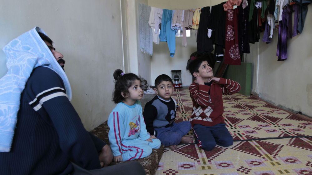 A family of Syrian refugees in a camp set up near the Jordanian city of Mafraq, near the Syrian border. Jordan has welcomed Syrian refugees, but has limited resources to help them.