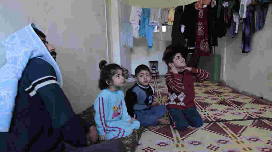 A family of Syrian refugees in a camp set up near the Jordanian city of Mafraq, near the Syrian border. Jordan has welcomed Syrian refugees, but has limited resources to help them.