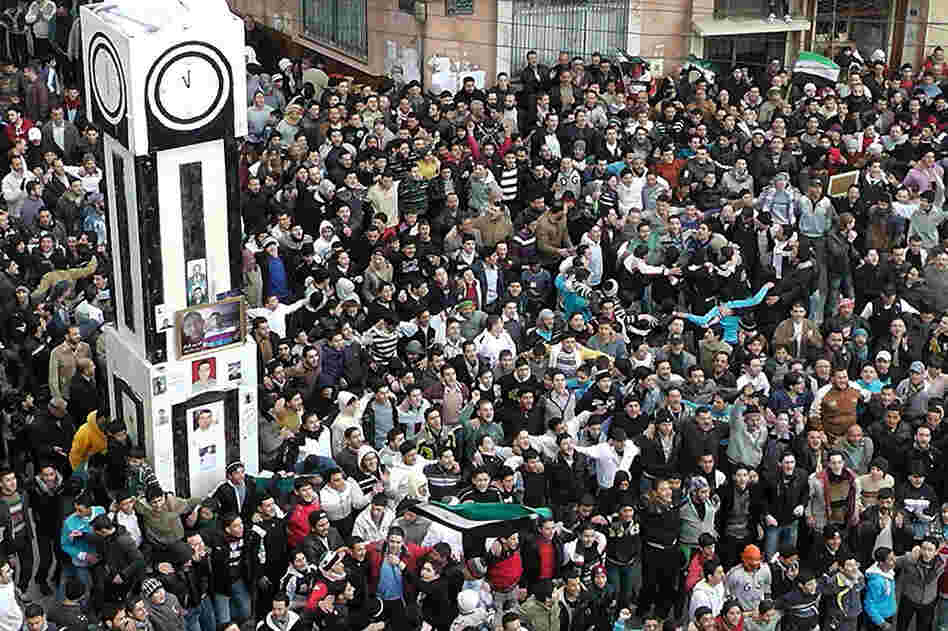 Anti-government protesters gather in Homs on Jan. 20, to demand that Assad agree to an Arab League plan to end the bloodshed. 