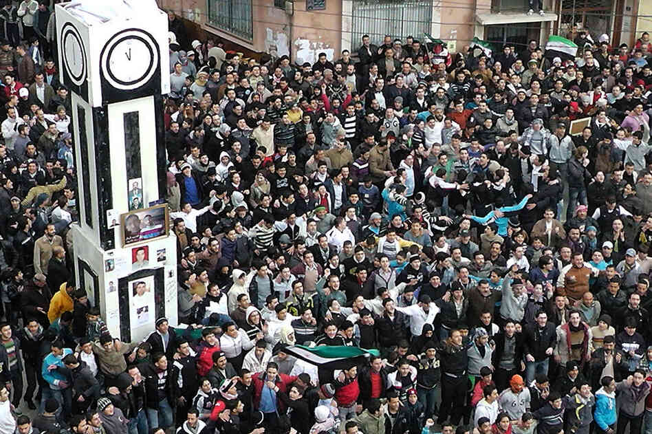 Anti-government protesters gather in Homs on Jan. 20, to demand that Assad agree to an Arab League plan to end the bloodshed. 
