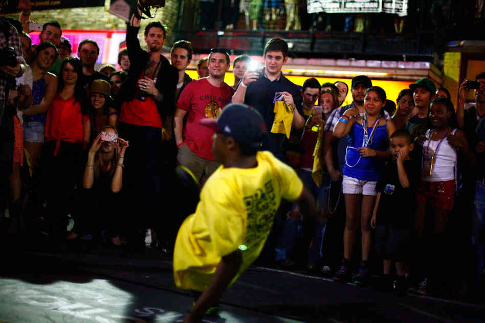 Break dancers perform on 6th Street at SXSW in Austin, Texas.