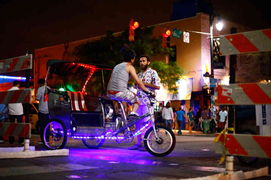 Old and busted: Getting to that Tanlines show by foot. The new hotness: Purple light rickshaws.