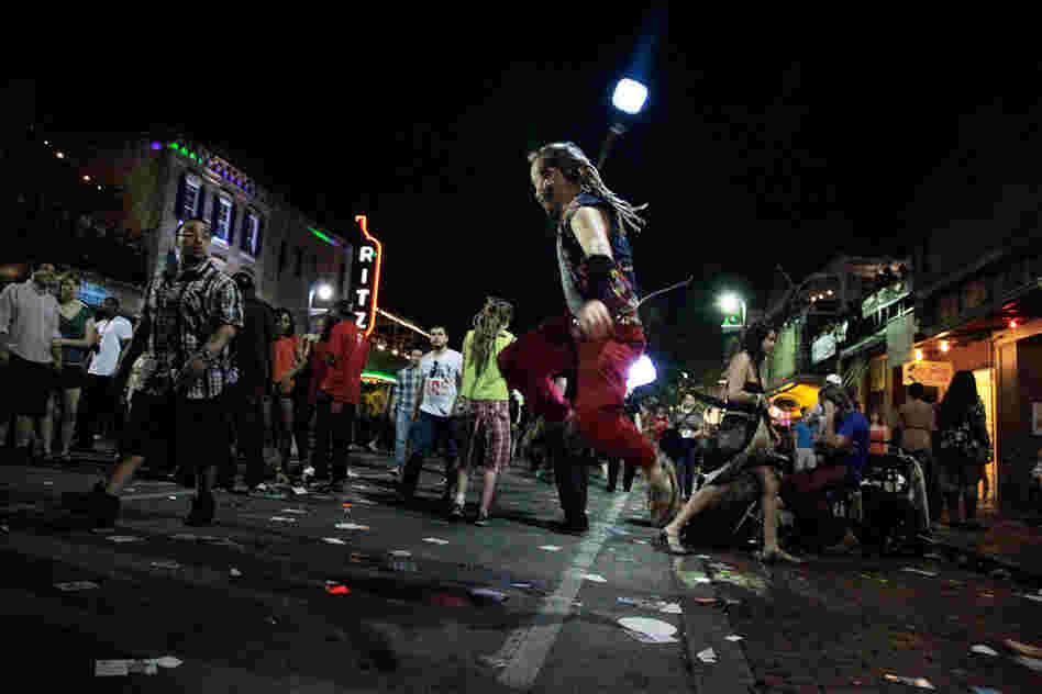 We don't really know what poi dancing is, but it makes sense that a dude in dreadlocks has taken to bright, swirling lights.