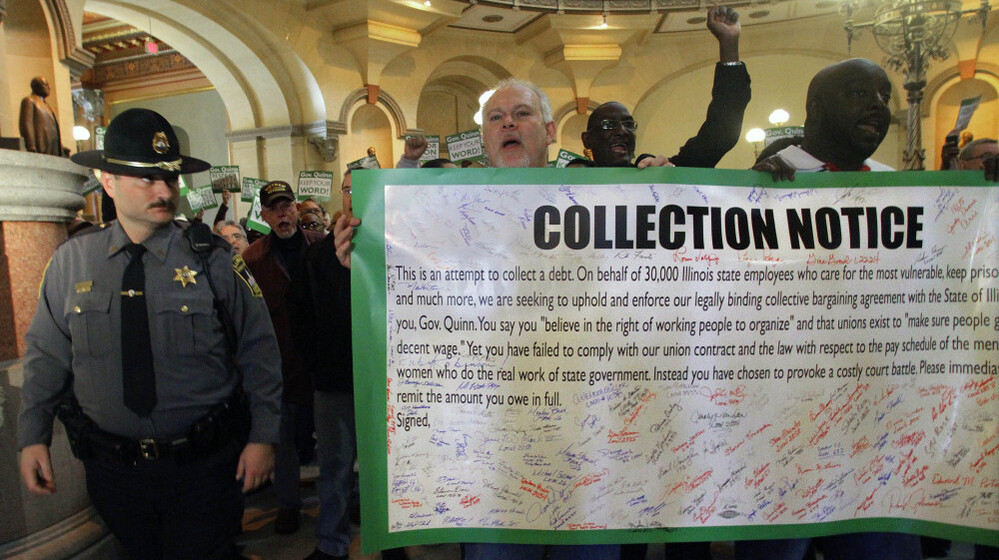 Union members rally outside of Illinois Gov. Pat Quinn's office on Feb. 2, demanding pay raises he withheld. Quinn said the state doesn't have the money to cover the raises.