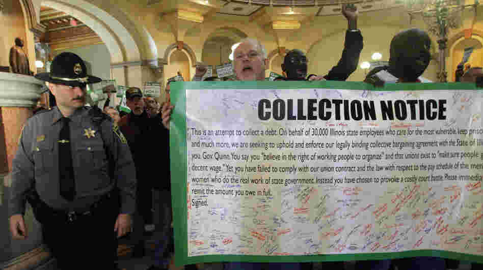 Union members rally outside of Illinois Gov. Pat Quinn's office on Feb. 2, demanding pay raises he withheld. Quinn said the state doesn't have the money to cover the raises.