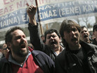 Shipyard workers demand their unpaid wages in central Athens on Thursday, the day that countries in the 17-nation euro zone formally approved a second bailout of $36.6 billion for Greece. Shipyard workers demand their unpaid wages in central Athens on Thursday, the day that countries in the 17-nation euro zone formally approved a second bailout of $36.6 billion for Greece.