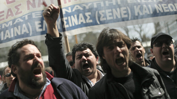 Shipyard workers demand their unpaid wages in central Athens on Thursday, the day that countries in the 17-nation euro zone formally approved a second bailout of $36.6 billion for Greece. Shipyard workers demand their unpaid wages in central Athens on Thursday, the day that countries in the 17-nation euro zone formally approved a second bailout of $36.6 billion for Greece.